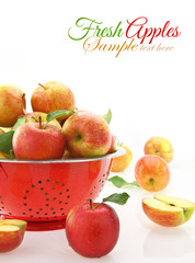 Apples in colander, isolated on white