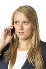 Blond phoning serious woman