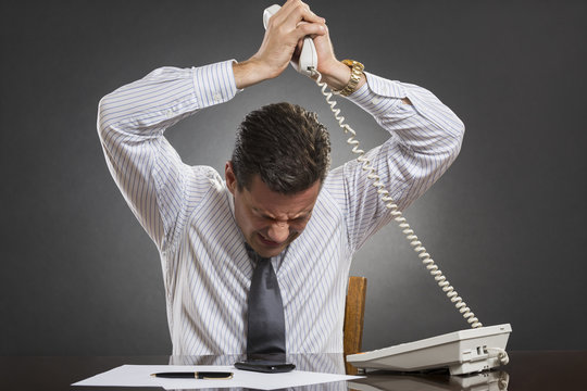 Businessman losing temper control during a phone conversation
