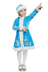 Little girl in blue costume of snow maiden pointing to side