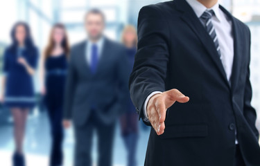 A business man with an open hand ready to seal a deal