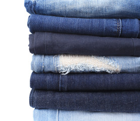 Stack of jeans isolated on white