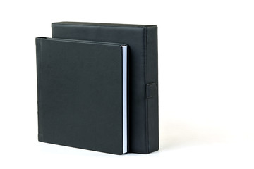Blank book with black cover and box on white background.