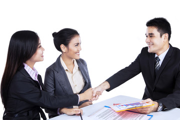 Smiling business people shaking hands