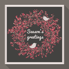 Holly wreath with two pretty birds. Season's greetings