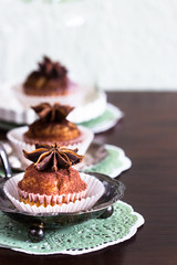 Cupcakes decorated with cocoa and star anise
