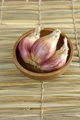 bowl of Garlic on straw mat
