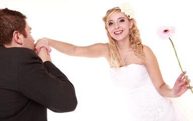 Wedding day. Male groom kissing hand of female bride.