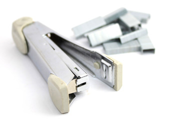 Stapler and staples isolated on white