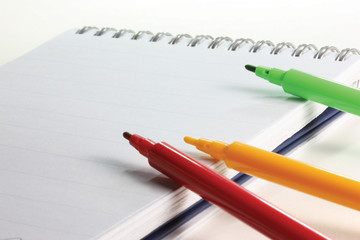 Felt tip pens on a notebook