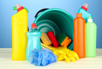 Cleaning items in bucket on  color background