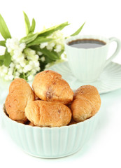 Tasty croissants and cup of coffee isolated on white