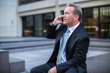 Caucasian businessman in New York City on cellphone