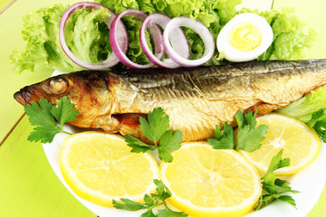 Smoked fish on plate close up