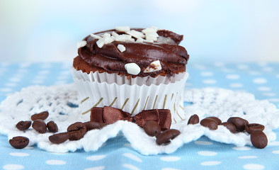 Tasty cupcake on table close up