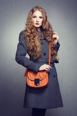 Portrait of young woman in autumn coat