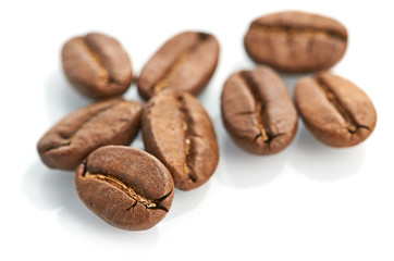 Macro of coffee beans isolated on white background