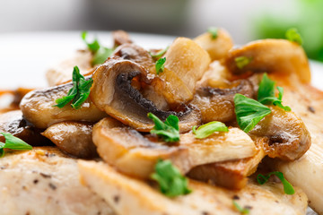 Fried chicken fillet with mushrooms