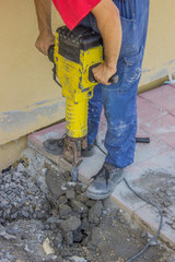 Builder worker with electric jackhammer 2