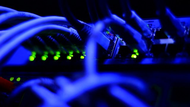 Working Ethernet computer close up - wires and blinking LED lights.
