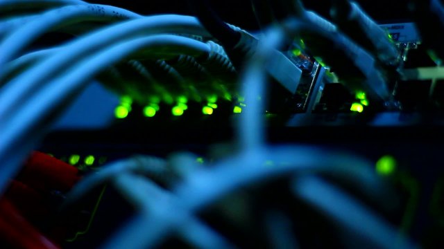 Working Ethernet computer close up - wires and blinking LED lights.