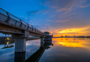 A pier at Putrajaya Lake, Malaysia at sunset.