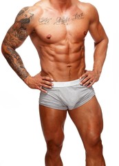Man with beautiful muscular tattooed torso in underwear