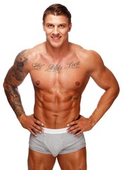 Fototapeta premium Man with beautiful muscular tattooed torso in underwear