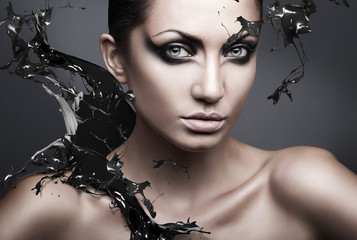 close up portrait of sexy brunette woman with black splash