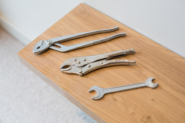 Work tools on wooden surface