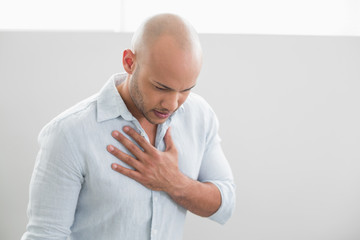 Casual young man with chest pain