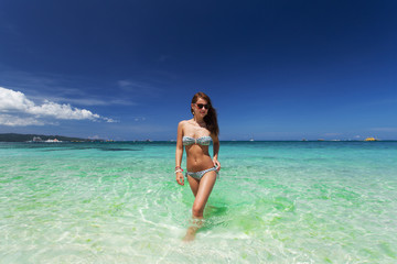 Woman posing on the beach