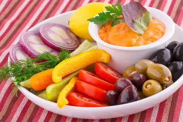 Vegetables, olives, lemon and cheese sauce