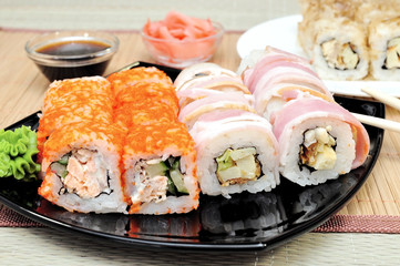 Japanese rolls with masago caviar, cheese and cucumber