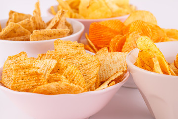 Potato and wheat chips in bowls
