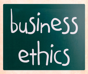 "Business Ethics" handwritten with white chalk on a blackboard