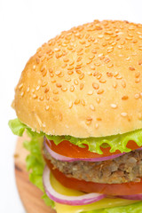 Burger with a vegetarian cutlet and fresh vegetables, close-up