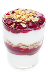 close-up of layered dessert with yogurt, granola and cherry