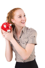 Redhead with piggybank isolated on the white