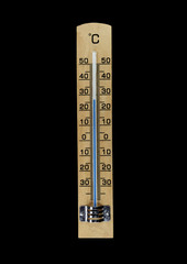 wooden thermometer isolated on black background