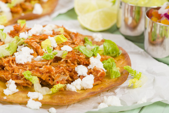 Tostadas - Mexican crispy tortilla with chicken tinga and cotija