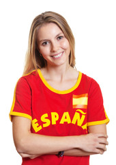 Laughing spanish sports fan with crossed arms