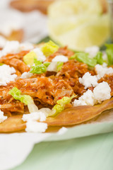 Tostadas - Mexican crispy tortilla with chicken tinga and cotija