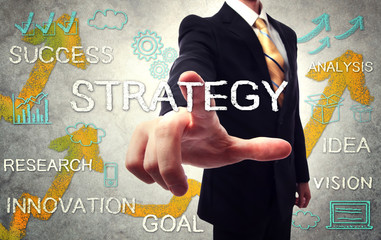 Businessman pointing STRATEGY