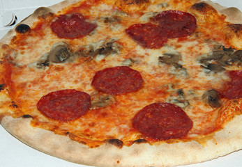 tasty pizza with pepperoni and mushrooms