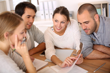 Group of business people in office working on project