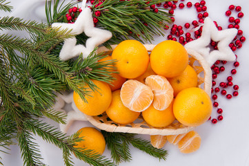 Fototapeta na wymiar Christmas decoration with mandarins and fir tree