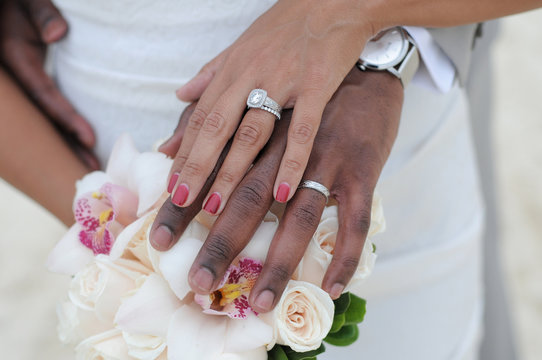 black couple hands and flowers