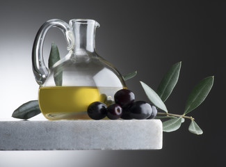 still life with bottle of olive oil and olives