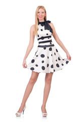 Tall model dressed in dress with polka dosts on white